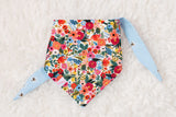 Floral patterned bandana with blue ties on a white background